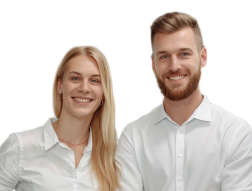 Two smiling coworkers, a blonde woman and a bearded man, stand side by side in white shirts.